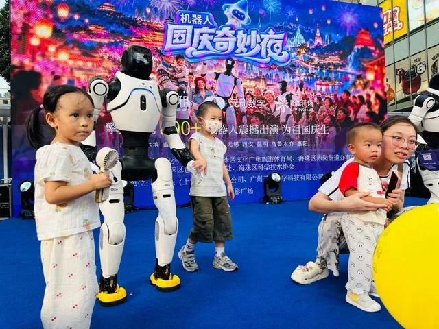 Visitors interacting with humanoid robots at the Guangdong Science Center